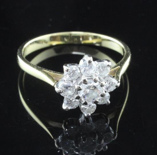 An 18ct gold and diamond cluster ring, size M.